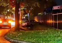 Automobilist in de berm op industrieterrein in Oisterwijk